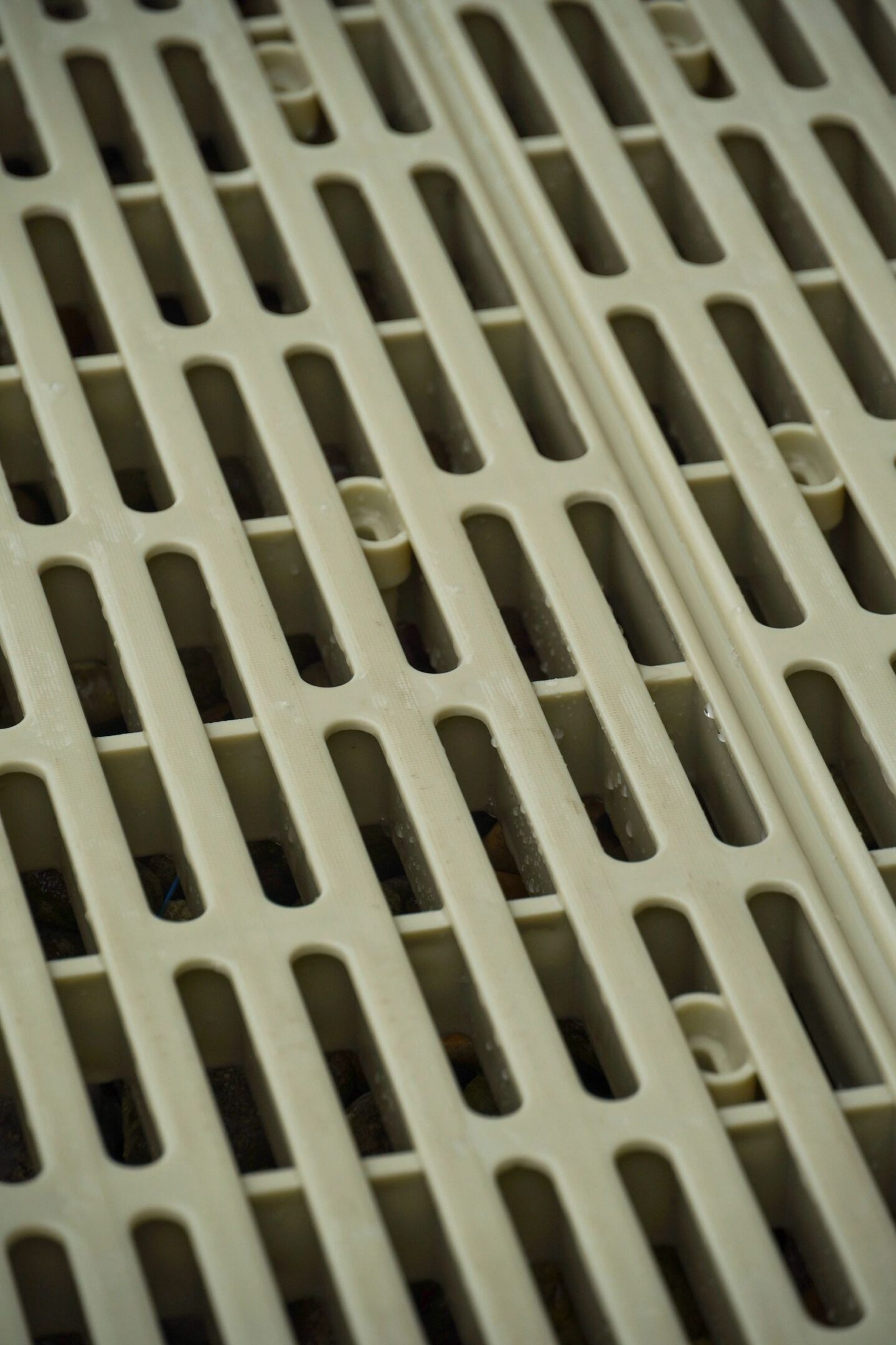 Beige slotted plastic vent cover