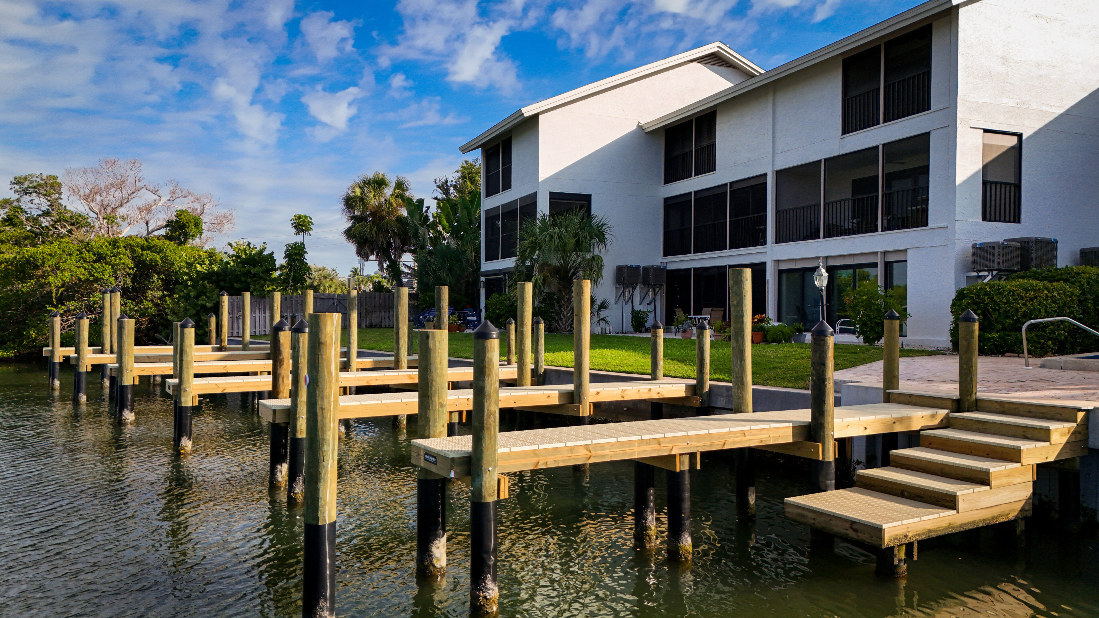 Waterfront house with wooden dock.